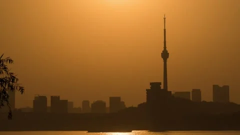 Wuhan TV Tower Sunset Time-lapse with Golden Sky and City Skyline Vista Stock Footage 326674618