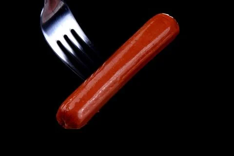 Wurstel in the fork Stock Photos