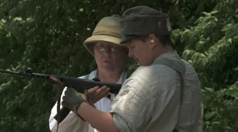WW1 Father teaching Son machine gun 2 Video stock 43451155