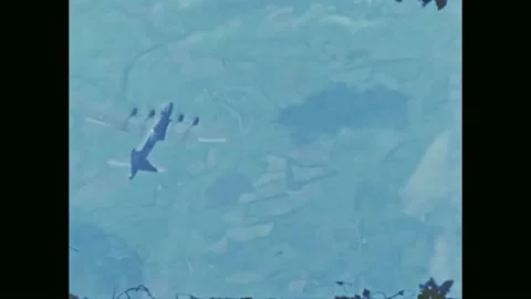 WW2 B-17 Bomber - Pilot plays harmonica on bomb trailer. Stock Footage 233277792