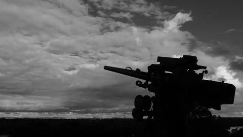 WW2 cannon angry clouds Stock Footage 102462573