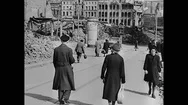 Ww2 - Civilians Walk Through Bombed German City Stock Footage