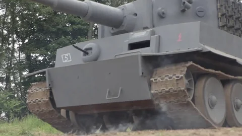 WW2 explosion in front of Tiger tank and german soldiers firing from halftrack Stock Footage 78986031