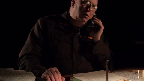 WW2 General George S. Patton in command at a Desk in Europe - Actor Portrayal Stock Footage 209630305