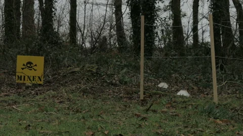 WW2 german minefield with mine warning sign. Stock Footage 47394203