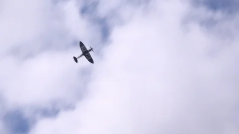 WW2 spitfire Military plane doing aerobatics in air show UK 4K Stock Footage 115965124
