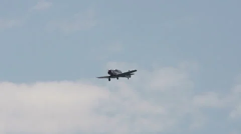 WWII Fighter Passing by Clouds with Gear Down Stock Footage 24119995