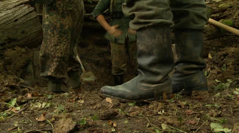 WWII Germans digging foxhole 2 Stock Footage 33653583