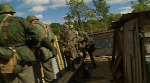 WWII Germans fire from trench Stock Footage 33653779