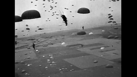WWII US - Parachute drop at D-Day invasion in Normandy Stock Footage