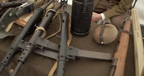 WWII weapons display by reenactors featuring British PIAT and Sten guns. 库存影片 314000658