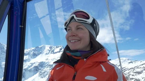 Wwoman goes to the top of the mountain in a cable car Stock Footage 83573699