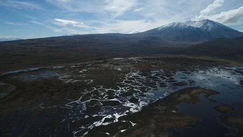 Wyle mountain with snow at background, strange lagoons with several islands 스톡 동영상 90828149