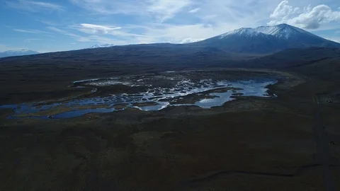 Wyle mountain with snow at background, strange lagoons with several islands 스톡 동영상 90912819