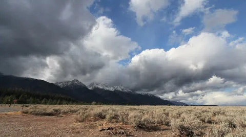 Wyoming clouds over Tetons time lapse Stock Footage 24692813
