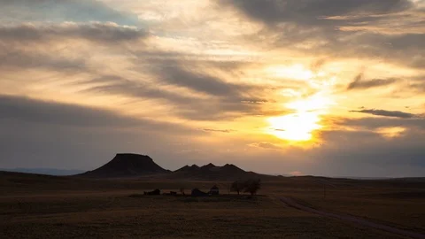 Wyoming - Clouds Rolling Over Abandoned Ranch House Sunset - 4K Timelapse Stock Footage 109142527