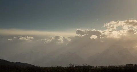Wyoming - Sun Rays Snow Storm Over Tetons - 4K Timelapse Stock Footage 112009082