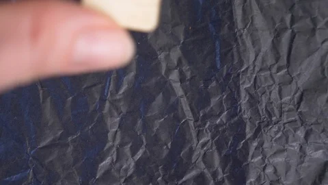 Wyrd rune. close-up, hand puts the rune on the surface for divination. 4k, slow Video stock 87879546