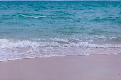 X-default Gentle Waves Reaching a Quiet Okinawa Sandy Beach Stock Photos