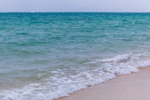 X-default Gentle Waves Reaching a Quiet Okinawa Sandy Beach Stock Photos