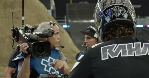 X-Games Camera Man Shooting Broadcast of Motocross Dirt Bike Riders Stock Footage 185409863