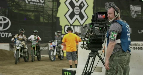 X-Games Camera Man Shooting Broadcast of Motocross Dirt Bike Riders Stock Footage 185410608