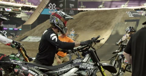 X-Games Camera Man Shooting Broadcast of Motocross Dirt Bike Riders Stock Footage 185410879