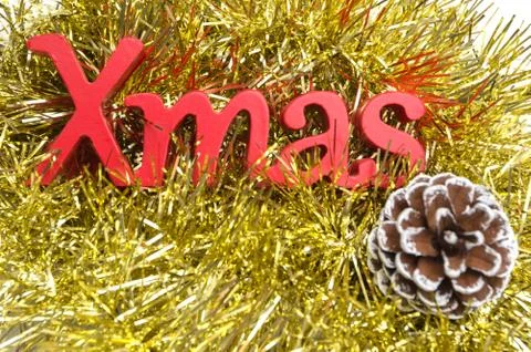 X-mas text and pine cone on christmas decoration Stock-Fotos