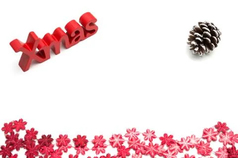 X-mas text and  pine cone, red snow flower decoration on white background Stock Photos