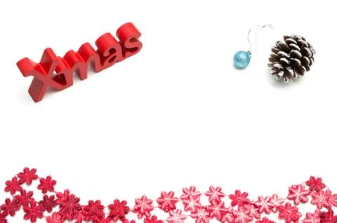 X-mas text and  pine cone, ball, red snow flower decoration on white backgrou Stock Photos
