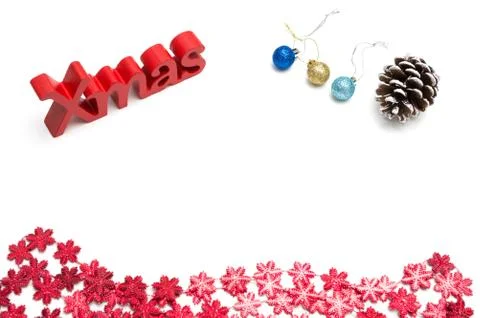 X-mas text and  pine cone, ball, red snow flower decoration on white backgrou Stock Photos