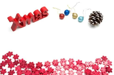 X-mas text and  pine cone, ball, red snow flower decoration on white backgrou Stock Photos