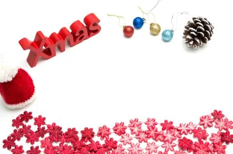 X-mas text and  pine cone, ball, fur hat, red snow flower decoration on white Stock Photos