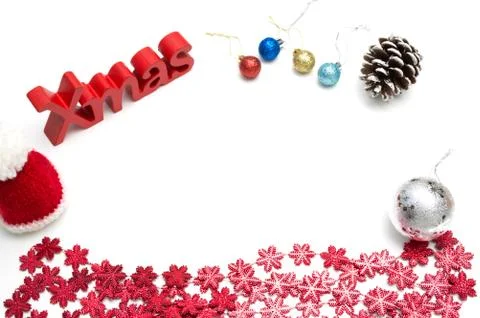 X-mas text and  pine cone, ball, fur hat, red snow flower decoration on white Stock Photos