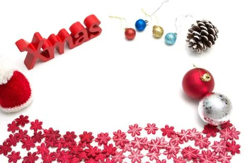 X-mas text and  pine cone, ball, fur hat, red snow flower decoration on white Stock Photos
