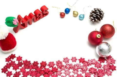 X-mas text and  pine cone, ball, fur hat, red snow flower decoration on white Stock Photos