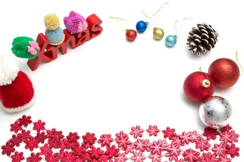 X-mas text and  pine cone, ball, fur hat, red snow flower decoration on white Stock Photos