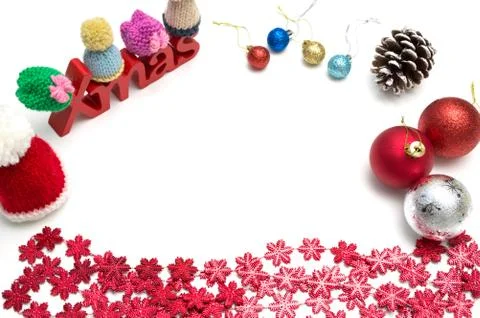 X-mas text and  pine cone, ball, fur hat, red snow flower decoration on white Stock Photos