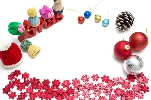 X-mas text and  pine cone, ball, fur hat, red snow flower decoration on white Stock Photos