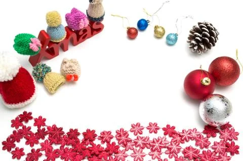 X-mas text and  pine cone, ball, fur hat, red snow flower decoration on white Stock Photos