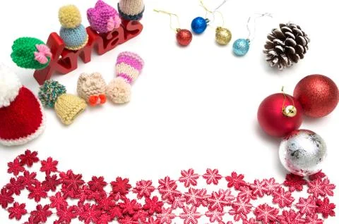 X-mas text and  pine cone, ball, fur hat, red snow flower decoration on white Foto stock