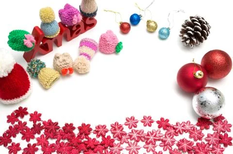 X-mas text and  pine cone, ball, fur hat, red snow flower decoration on white Stock Photos
