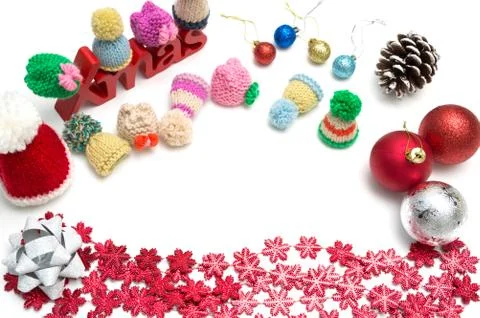 X-mas text and  pine cone, ball, fur hat, ribbon,  red snow flower decoration Foto stock