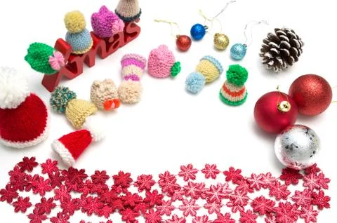 X-mas text and  pine cone, ball, fur hat, red snow flower decoration on white Stock Photos