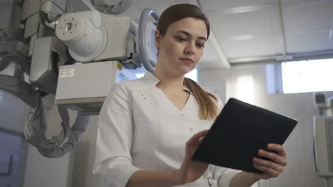 X-ray examination. X-ray on the tablet Woman doctor Stock Footage 107522563