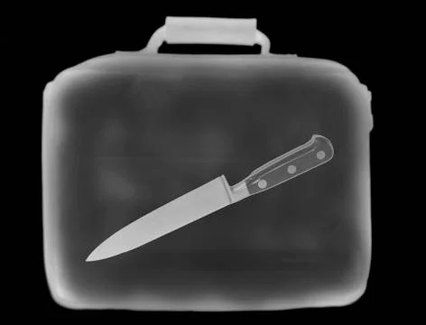 X-ray image showing briefcase containing knife Illustrazione stock