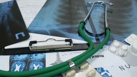 X-ray of the lungs and hands on the doctor's desk Stock Footage 87358696