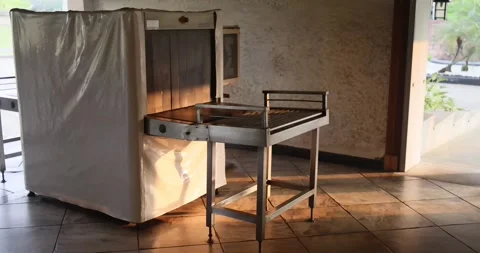 X-ray machine for detecting prohibited items luggage is highlighted by the sun Video stock 253893291