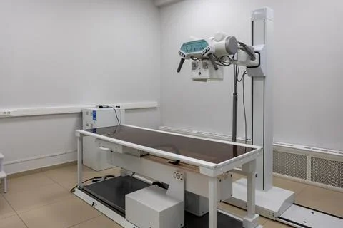 X-ray machine. An X-ray room with a scanning machine and an empty bed. Scanning Stock Photos