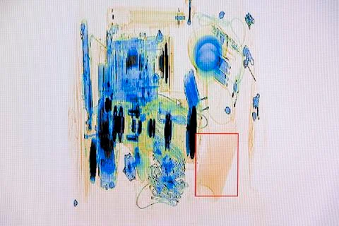 X-ray screenshot of an backpack filled with tele zoom camera and camcorder Stock Photos